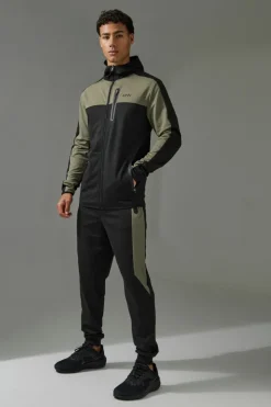 Shop boohooMAN Active Colour Block Funnel Hooded Tracksuit khaki