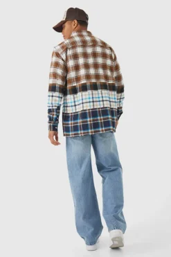 Shop boohooMAN Baggy Rigid Distressed Jeans ice blue
