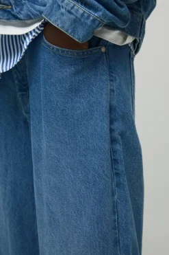 Shop boohooMAN Belted Baggy Fit Jeans light wash