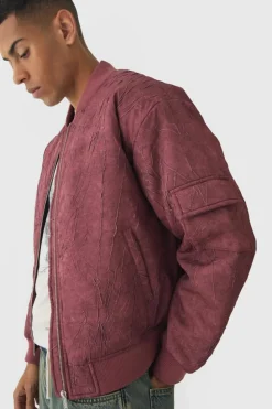Store boohooMAN Boxy Crinkle Washed Padded Bomber Jacket In red