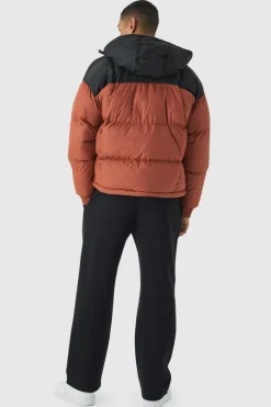 Discount boohooMAN Boxy Curved Quilted Colour Block Hooded Puffer In rust