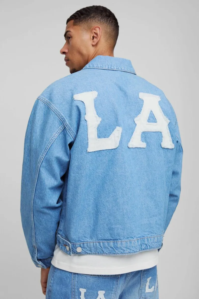 Online boohooMAN Boxy Denim LA Applique Denim Jacket light blue