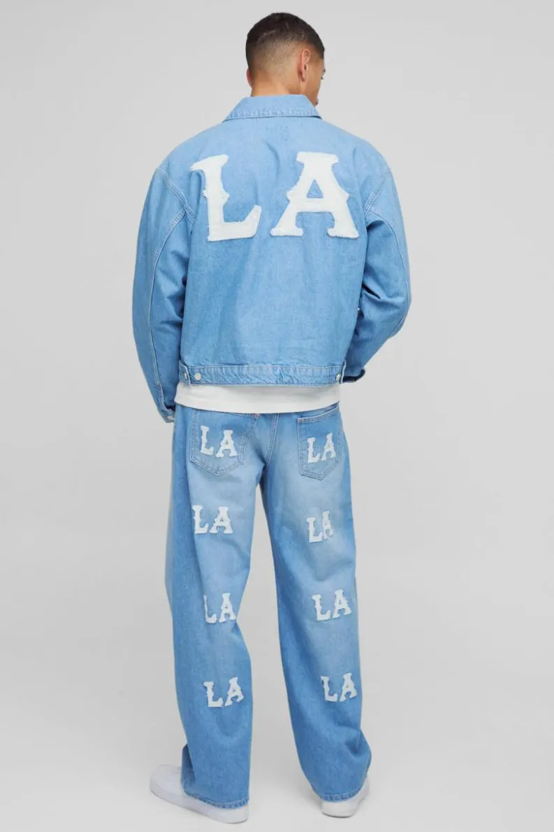 Online boohooMAN Boxy Denim LA Applique Denim Jacket light blue