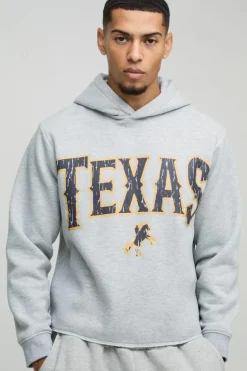 Shop boohooMAN Boxy Marl Raw Hem Texas Western Hoodie grey marl