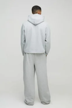 Shop boohooMAN Boxy Marl Raw Hem Texas Western Hoodie grey marl