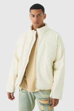Online boohooMAN Boxy Padded Moto Panelled Jacket In ecru