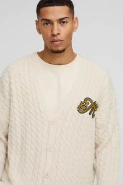 Shop boohooMAN Boxy Varsity Applique Knitted Cardigan ecru