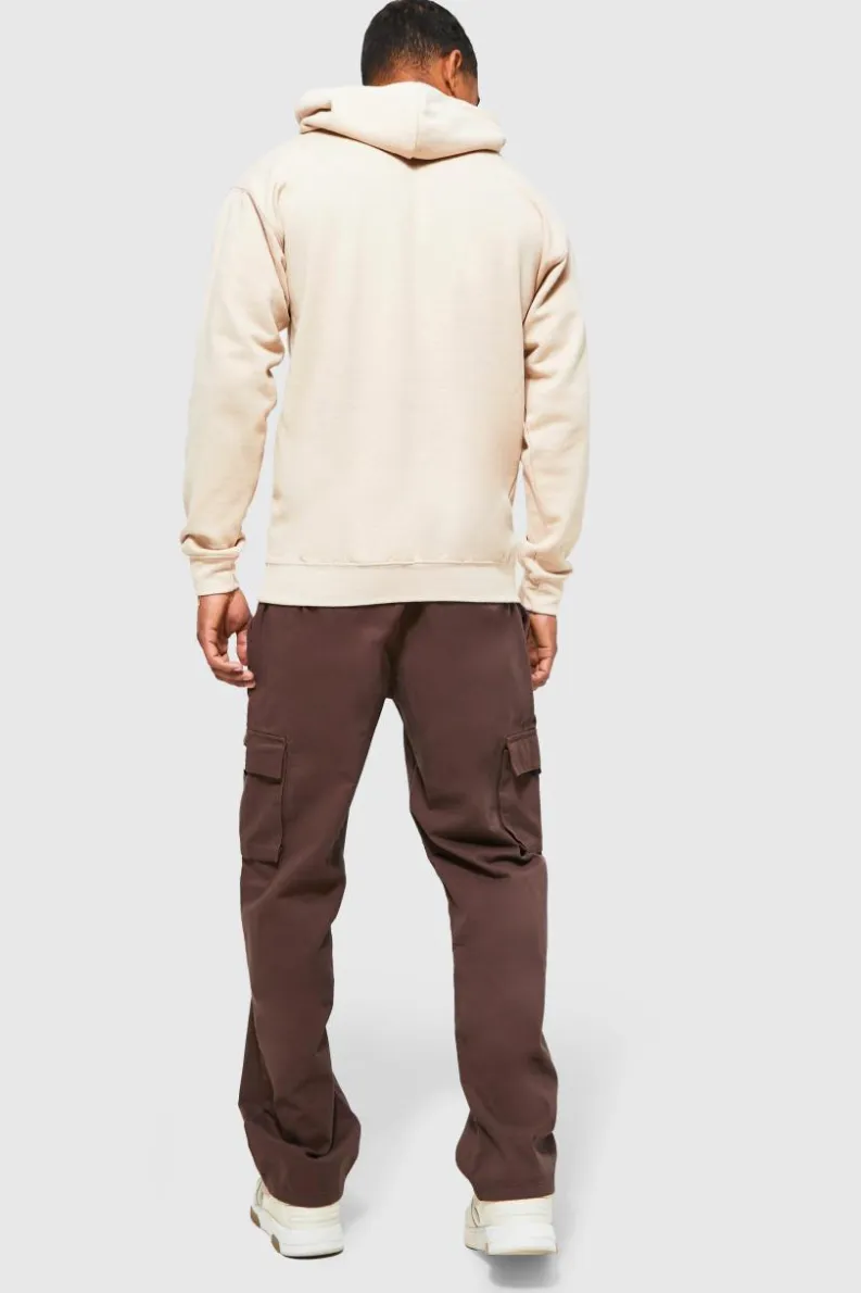 Shop boohooMAN Elasticated Waist Relaxed Fit Buckle Cargo Trouser chocolate