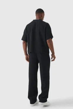 Store boohooMAN Elasticated Waist Relaxed Fit Pleated Trouser black