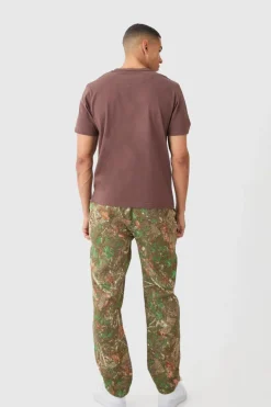 Shop boohooMAN Elasticated Waist Straight Leg Camo Tapestry Trouser khaki