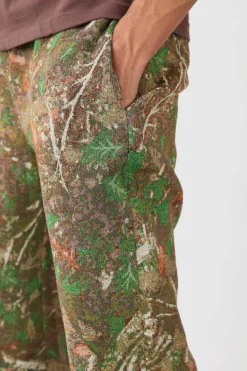 Shop boohooMAN Elasticated Waist Straight Leg Camo Tapestry Trouser khaki