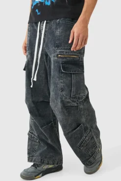 Shop boohooMAN Elastic Waist Acid Wash Parachute Cargo Jeans In black