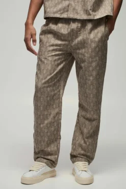 Shop boohooMAN Elastic Waist Straight Woven Geo Trouser stone