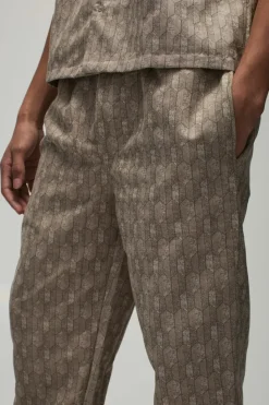 Shop boohooMAN Elastic Waist Straight Woven Geo Trouser stone