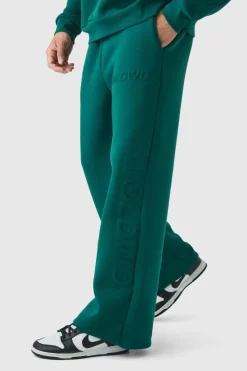 Shop boohooMAN Embossed Worldwide Wide Leg Jogger forest