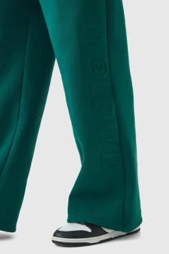 Shop boohooMAN Embossed Worldwide Wide Leg Jogger forest