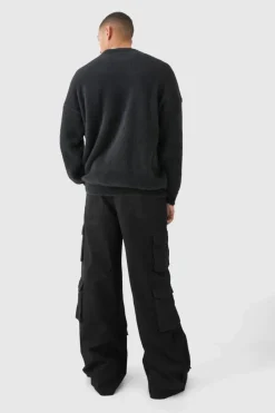 Shop boohooMAN Extreme Baggy Rigid Multi Cargo Pocket Trousers black