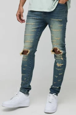 Cheap boohooMAN Extreme Rip Busted Knee Skinny Jeans mid wash