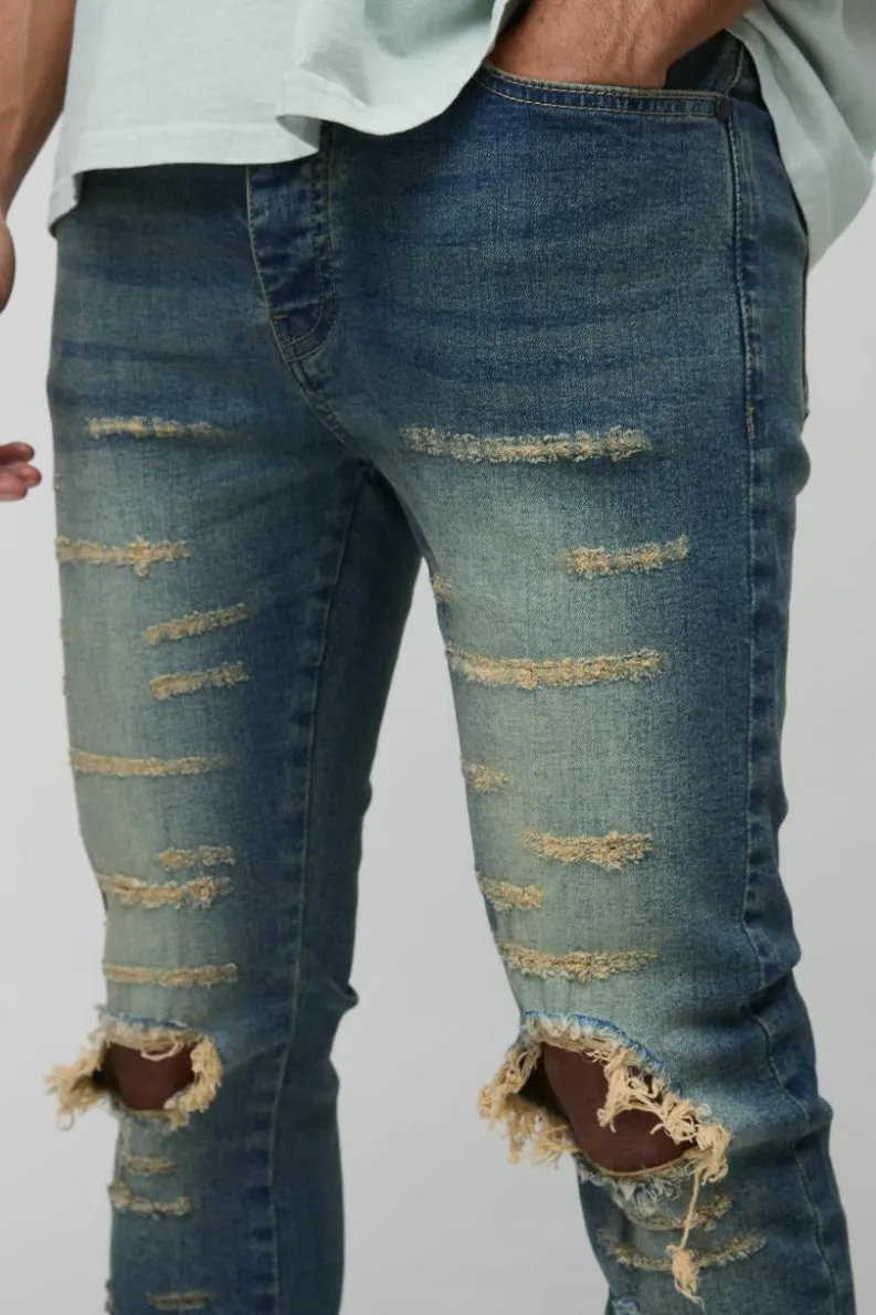 Cheap boohooMAN Extreme Rip Busted Knee Skinny Jeans mid wash