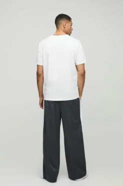 Outlet boohooMAN Extreme Wide Leg Graphic Tricot Joggers grey