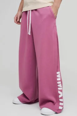 Store boohooMAN Extreme Wide Leg Pleated Gusset Jogger mauve