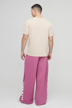 Store boohooMAN Extreme Wide Leg Pleated Gusset Jogger mauve