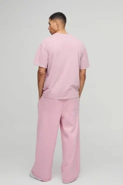 Shop boohooMAN Extreme Wide Leg Skeleton Puff Print Jogger pink