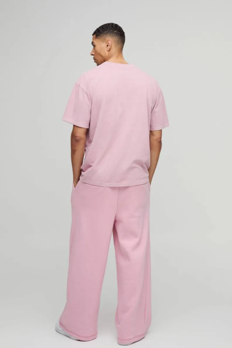 Shop boohooMAN Extreme Wide Leg Skeleton Puff Print Jogger pink