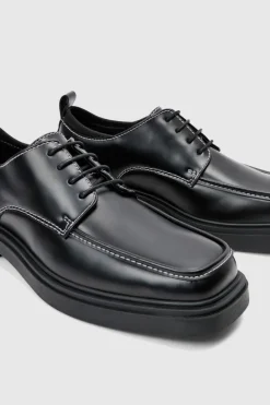 Store boohooMAN Faux Leather Contrast Stitch Derby Shoes In black