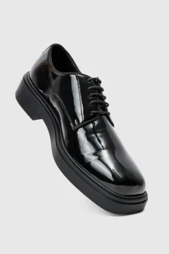 Shop boohooMAN Faux Leather Derby Shoes In black