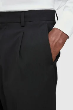 Shop boohooMAN Fixed Waist Pleat Front Tapered Tailored Trousers black
