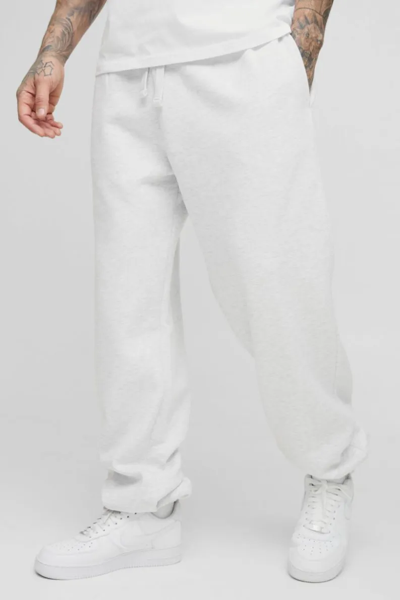 Store boohooMAN 330GSM Tall Oversized Jogger In grey marl