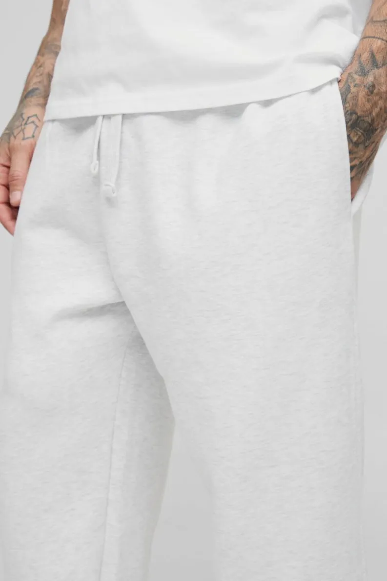 Store boohooMAN 330GSM Tall Oversized Jogger In grey marl