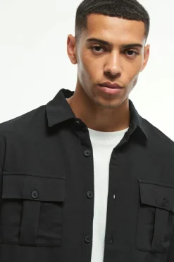 Shop boohooMAN Long Sleeve 4 Way Stretch Fit Overshirt black