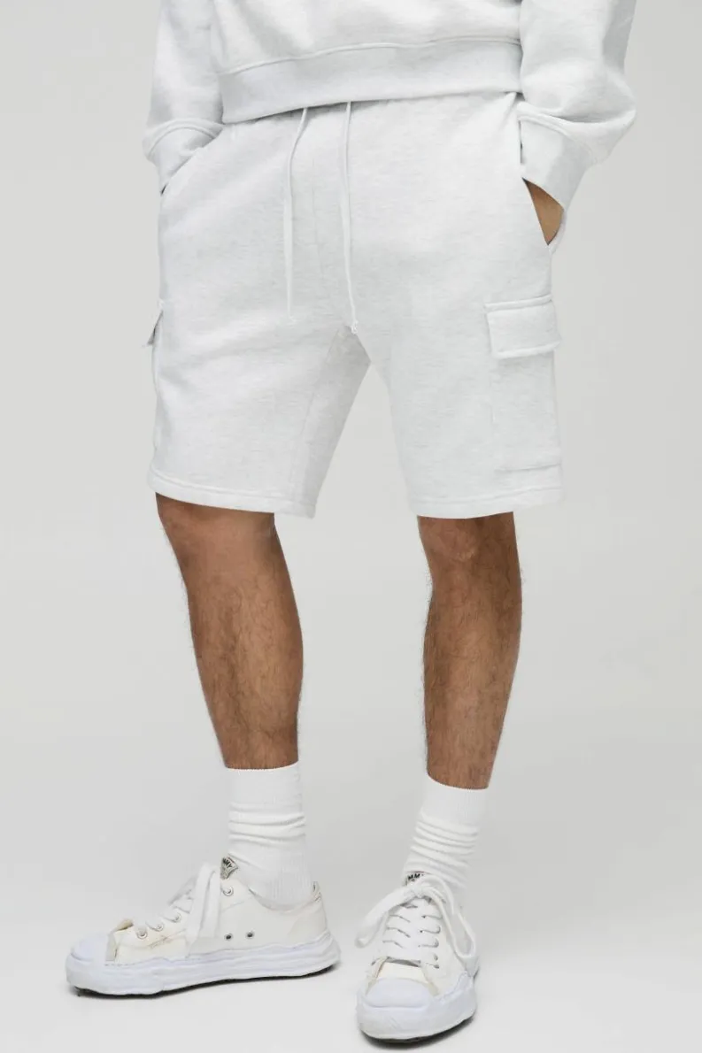 Shop boohooMAN Loose Fit Mid Length Cargo Shorts grey marl