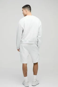 Shop boohooMAN Loose Fit Mid Length Cargo Shorts grey marl