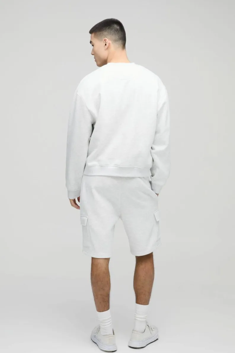 Shop boohooMAN Loose Fit Mid Length Cargo Shorts grey marl