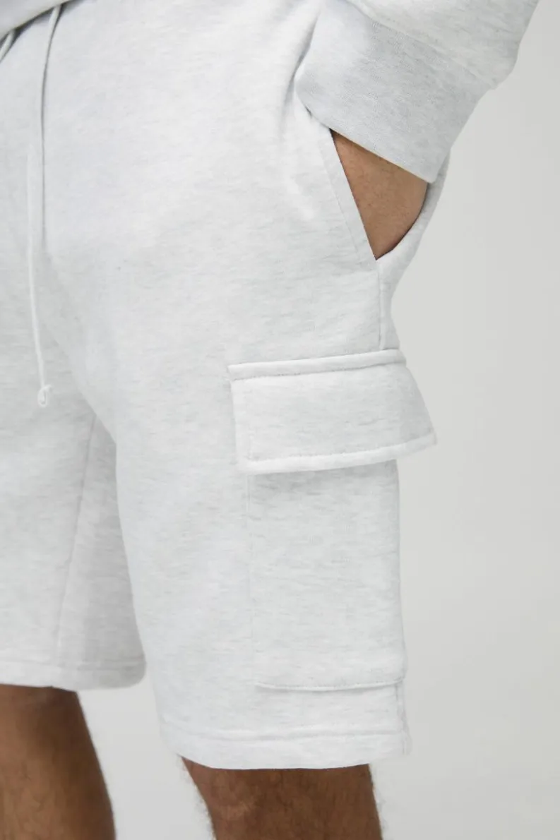 Shop boohooMAN Loose Fit Mid Length Cargo Shorts grey marl