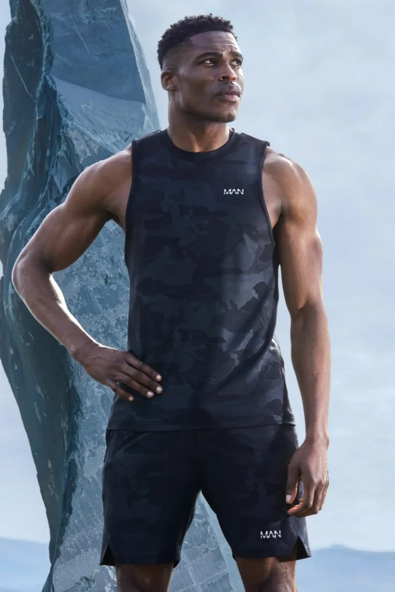 Store boohooMAN Man Active Camo Racer Performance Regular Fit Tank black