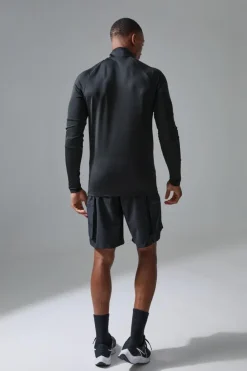 Shop boohooMAN Man Active Golf Raglan Muscle Fit 1/4 Zip black