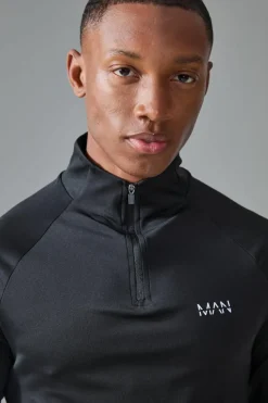 Shop boohooMAN Man Active Golf Raglan Muscle Fit 1/4 Zip black