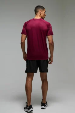 Shop boohooMAN Man Active Lightweight Essentials Gym Raglan T-shirt burgundy