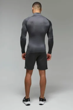 Shop boohooMAN Man Active Lightweight Essentials Gym Raglan Muscle Fit 1/4 Zip charcoal