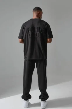 Shop boohooMAN Man Active Training Dept Oversized Embossed Jogger black