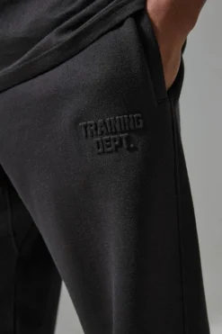 Shop boohooMAN Man Active Training Dept Oversized Embossed Jogger black