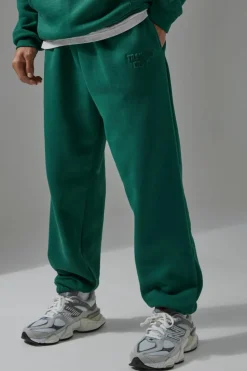 Shop boohooMAN Man Active Training Dept Oversized Embossed Jogger green