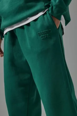Shop boohooMAN Man Active Training Dept Oversized Embossed Jogger green