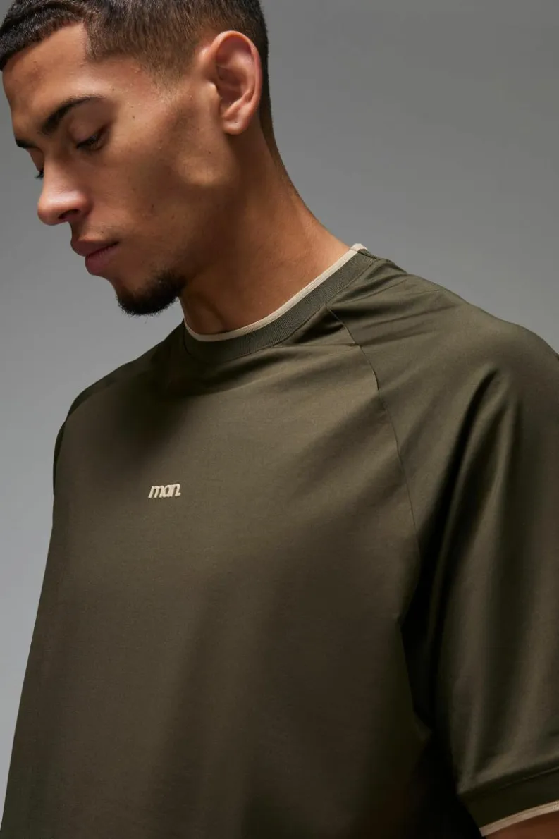 Shop boohooMAN Man Sport Oversized Performance T-shirt khaki