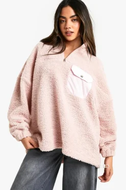 Store boohoo Nylon Pocket Detail Oversized Half Zip Borg Sweatshirt pink