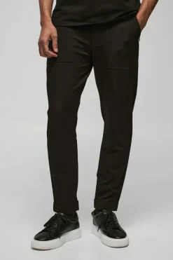 Shop boohooMAN Nylon Technical Stretch Slim Trouser black